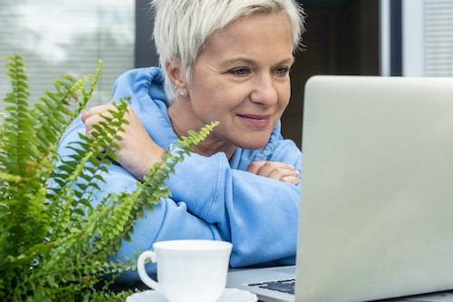 Buyer reviewing loan estimate information on a laptop