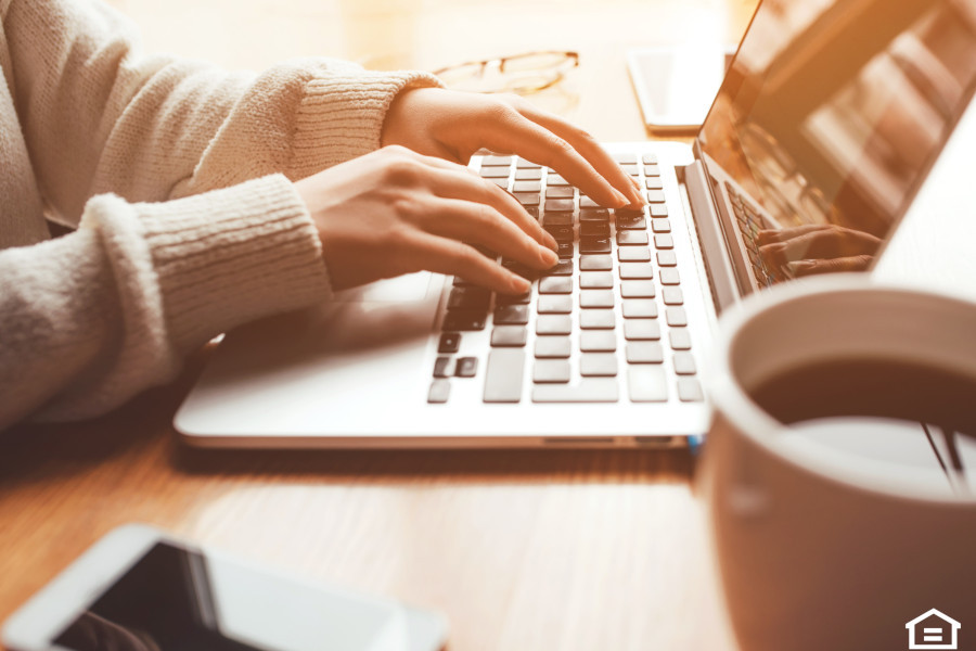 Laptop and coffee on a desk for mortgage planning