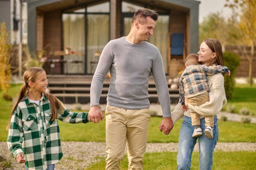 Military family outside a home