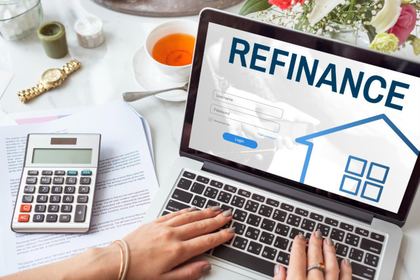 Laptop showing refinance information