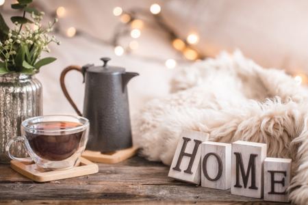 Cozy home scene with tea and HOME blocks