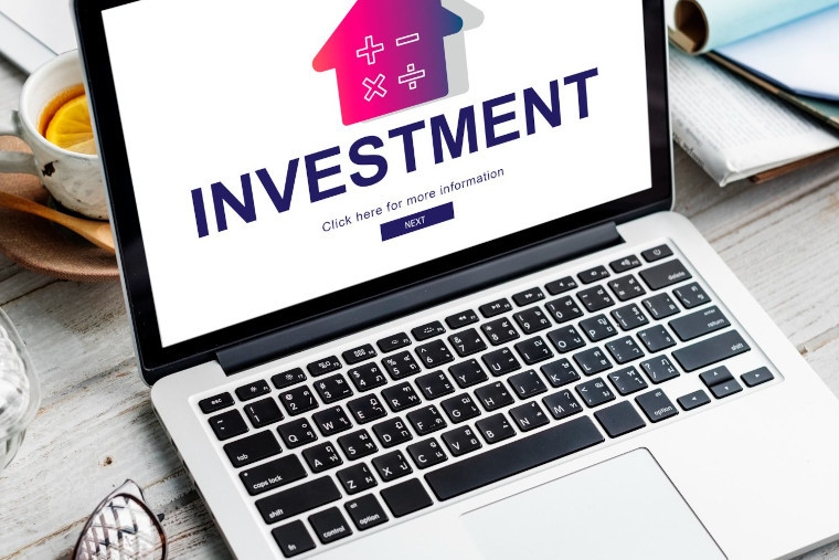 Laptop showing investment information