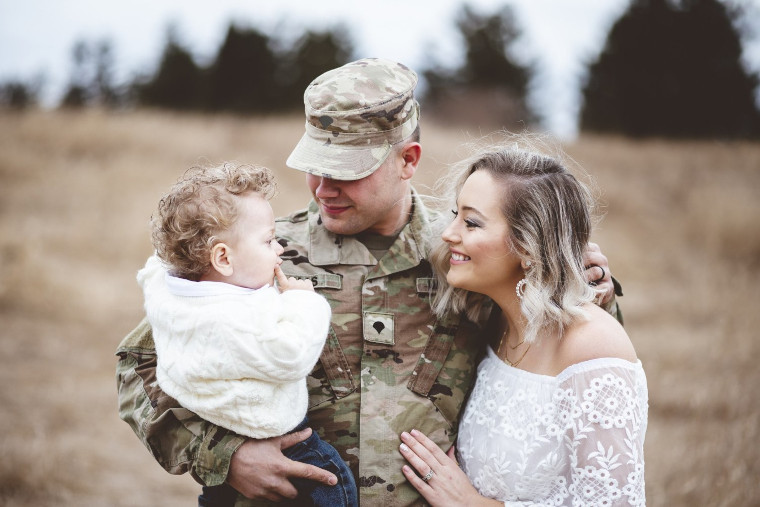 Military family smiling together outdoors