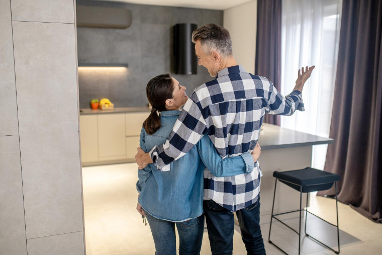 Couple reviewing home options with a real estate agent